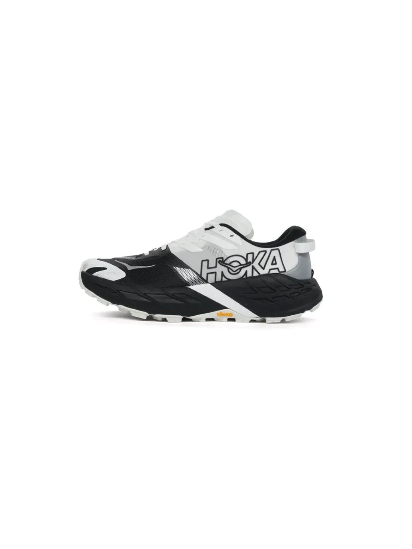 Hoka trail running shoe in black and white colorway, lateral view showing lugged outsole and HOKA branding