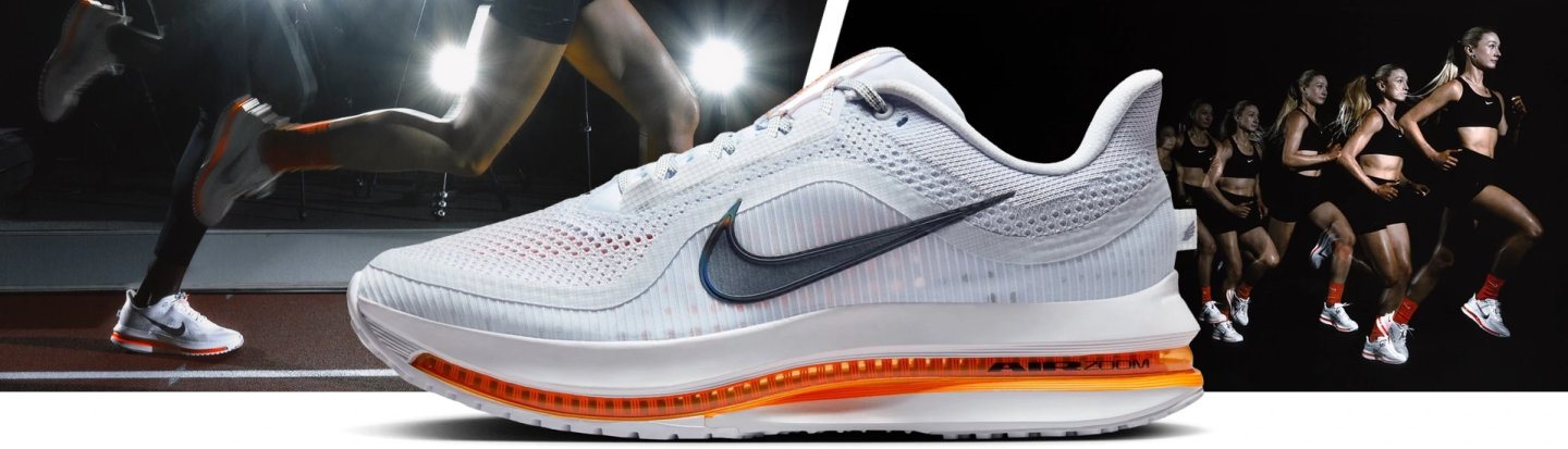 Nike Pegasus Premium running shoe in white with orange Air Zoom midsole unit, shown alongside athletes on a track