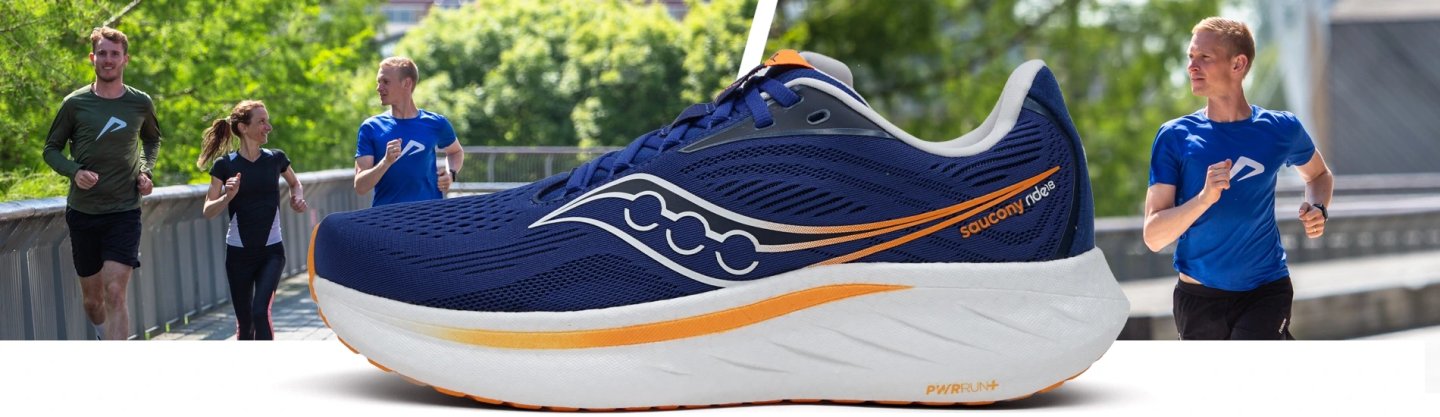 Saucony Ride running shoe in navy blue and orange with PWRRUN+ midsole, shown with runners on a bridge