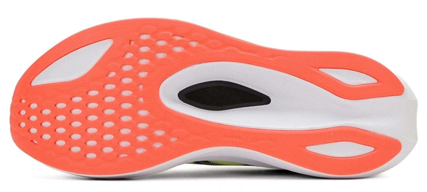 Bottom view of the ASICS Magic Speed 4 running shoe outsole in coral and white with perforated forefoot pattern.