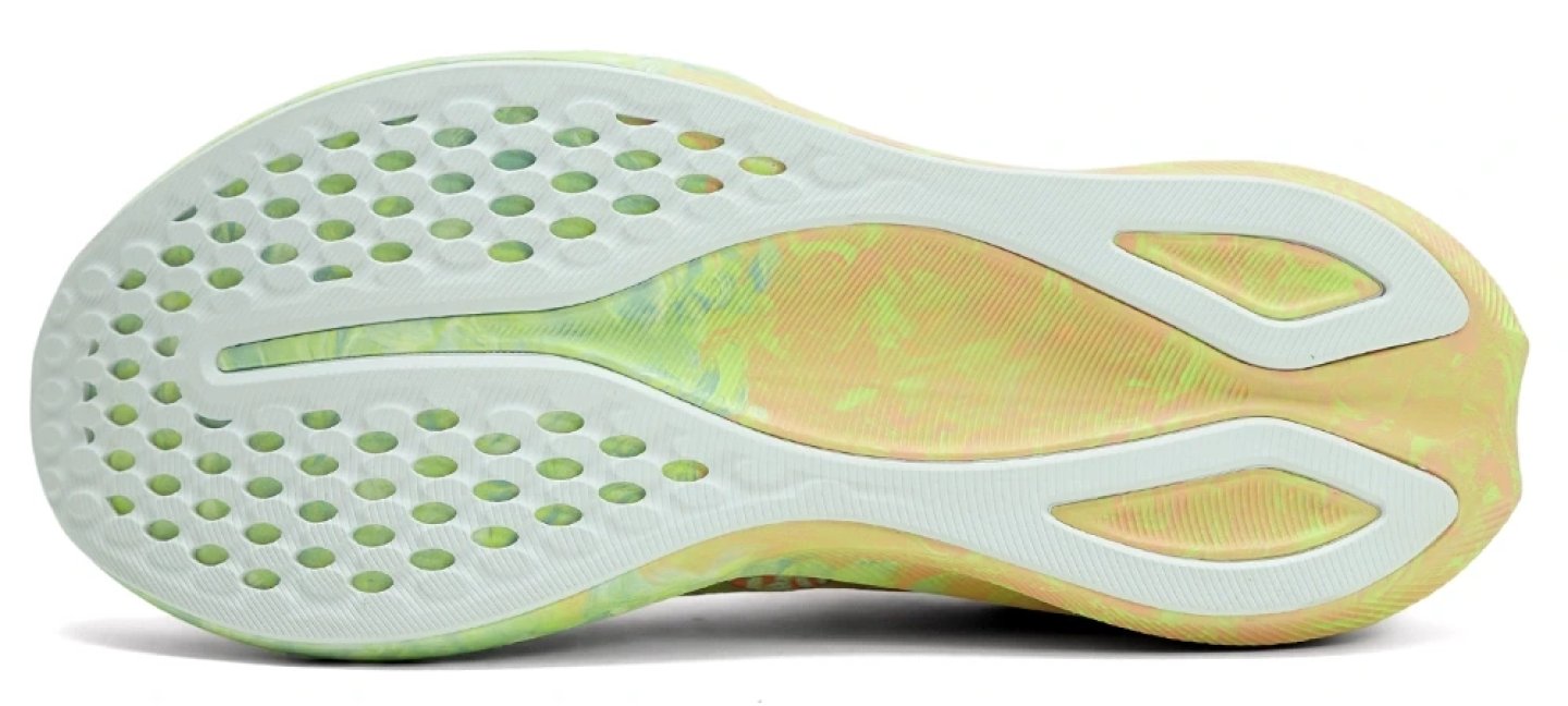 Bottom view of ASICS Noosa Tri running shoe outsole with white rubber pods, colourful marble midfoot, and curved heel design.