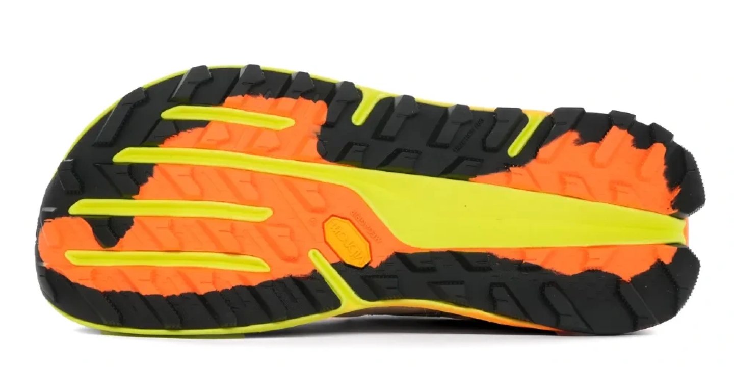 Bottom view of the Altra Olympus 7 trail running shoe outsole showing black rubber lugs, orange midsole and yellow rock plate.