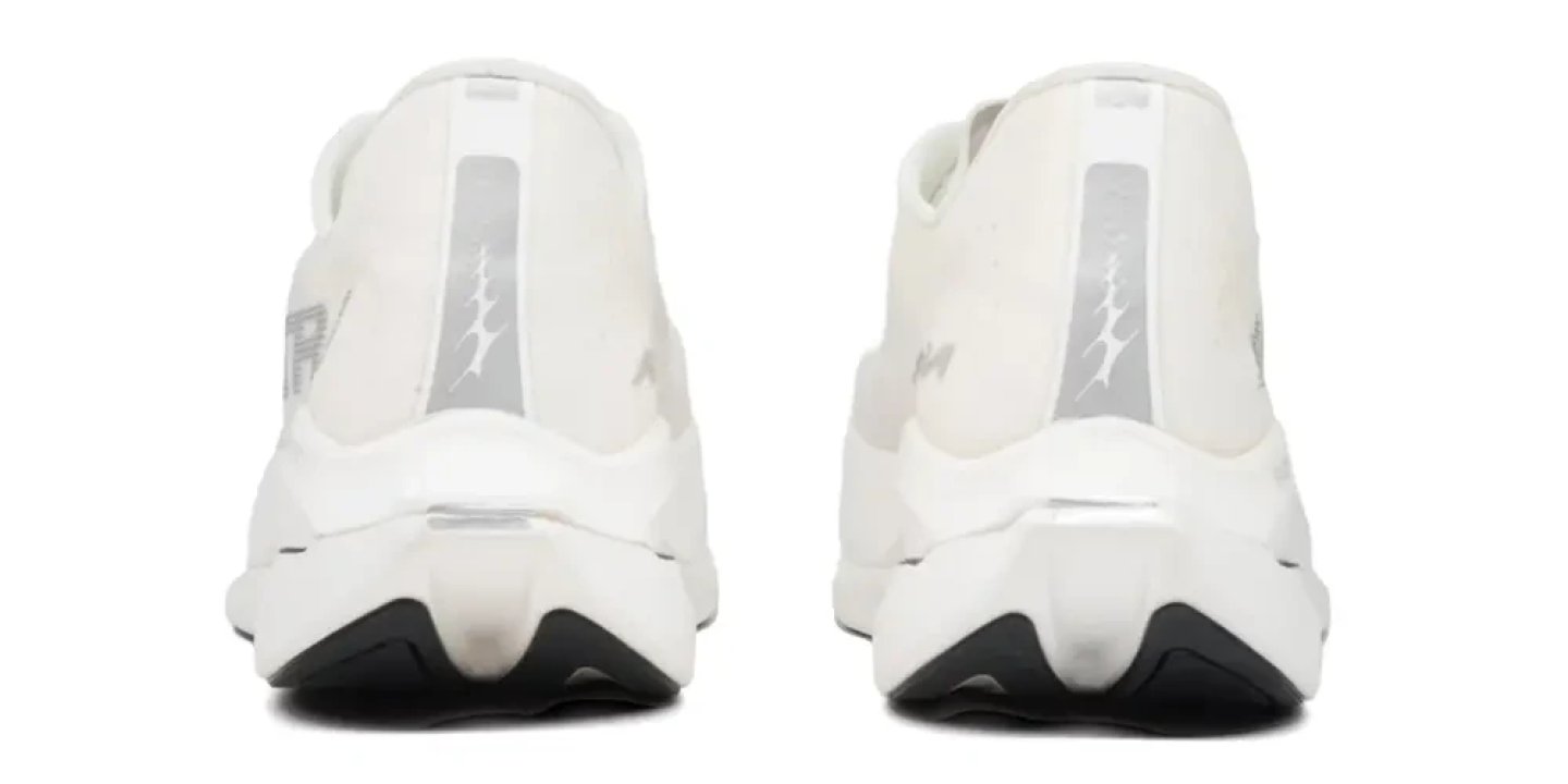 Altra Vanish Carbon 3 Women's running shoes in white, rear view showing heel counters and black outsole, studio background