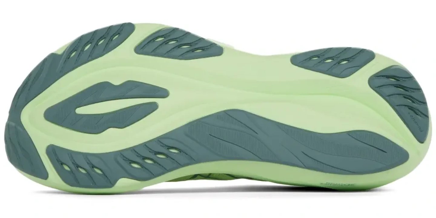Bottom view of the ASICS GT-2000 15 running shoe outsole in mint green and teal, showing rubber grip zones and flex grooves.