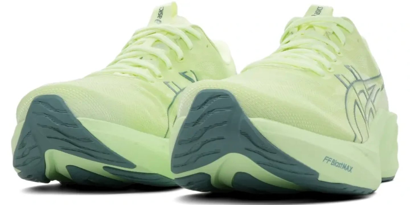 Pair of Asics GT-2000 15 running shoes in lime green with teal FF Blast MAX midsole, shown from rear three-quarter angle