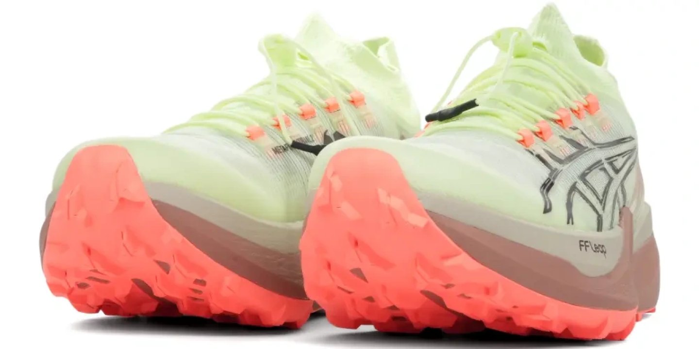 ASICS Metafuji Trail 2 trail running shoes shown from behind, highlighting coral FF Leap midsole and lugged outsole