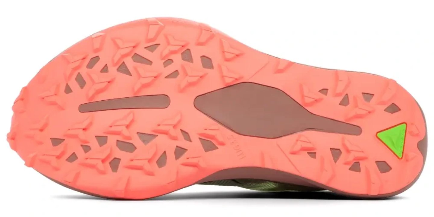 Bottom view of the ASICS Metafuji Trail 2 outsole in coral pink with triangular lugs and a neon green logo accent