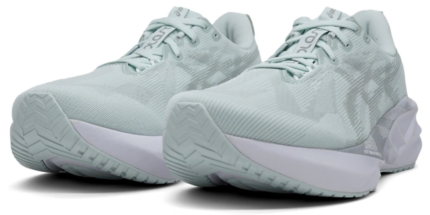 Pair of ASICS Novablast 5 running shoes in mint green and white, shown from the front-side angle on a white background.