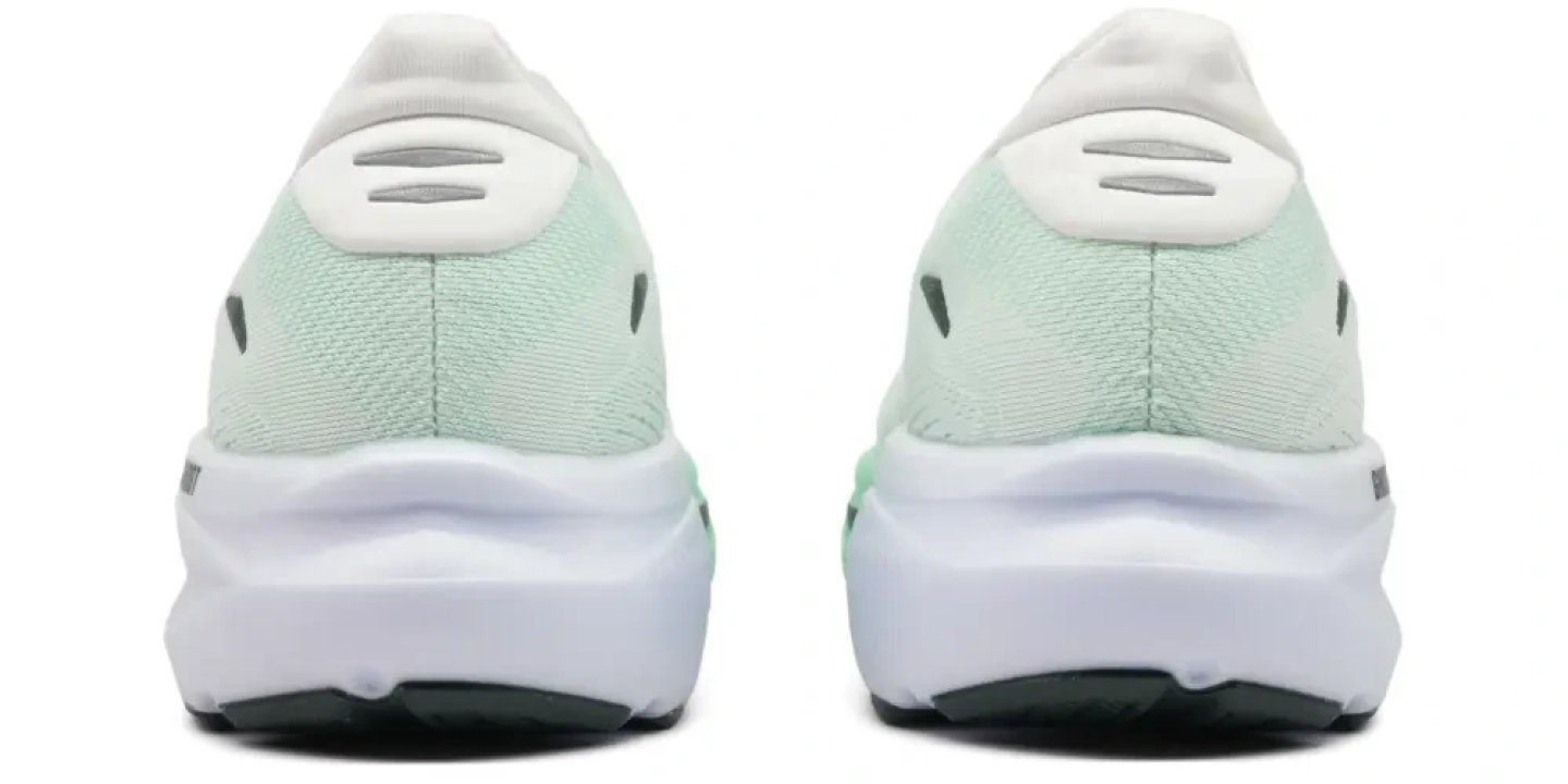 Brooks Ghost 18 running shoes rear view showing mint green knit upper, padded heel collar, and white cushioned midsole