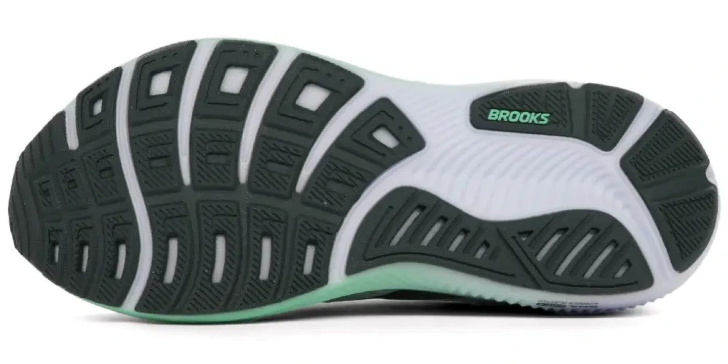 Bottom view of the Brooks Ghost 18 running shoe showing dark teal segmented rubber outsole with flex grooves and Brooks logo