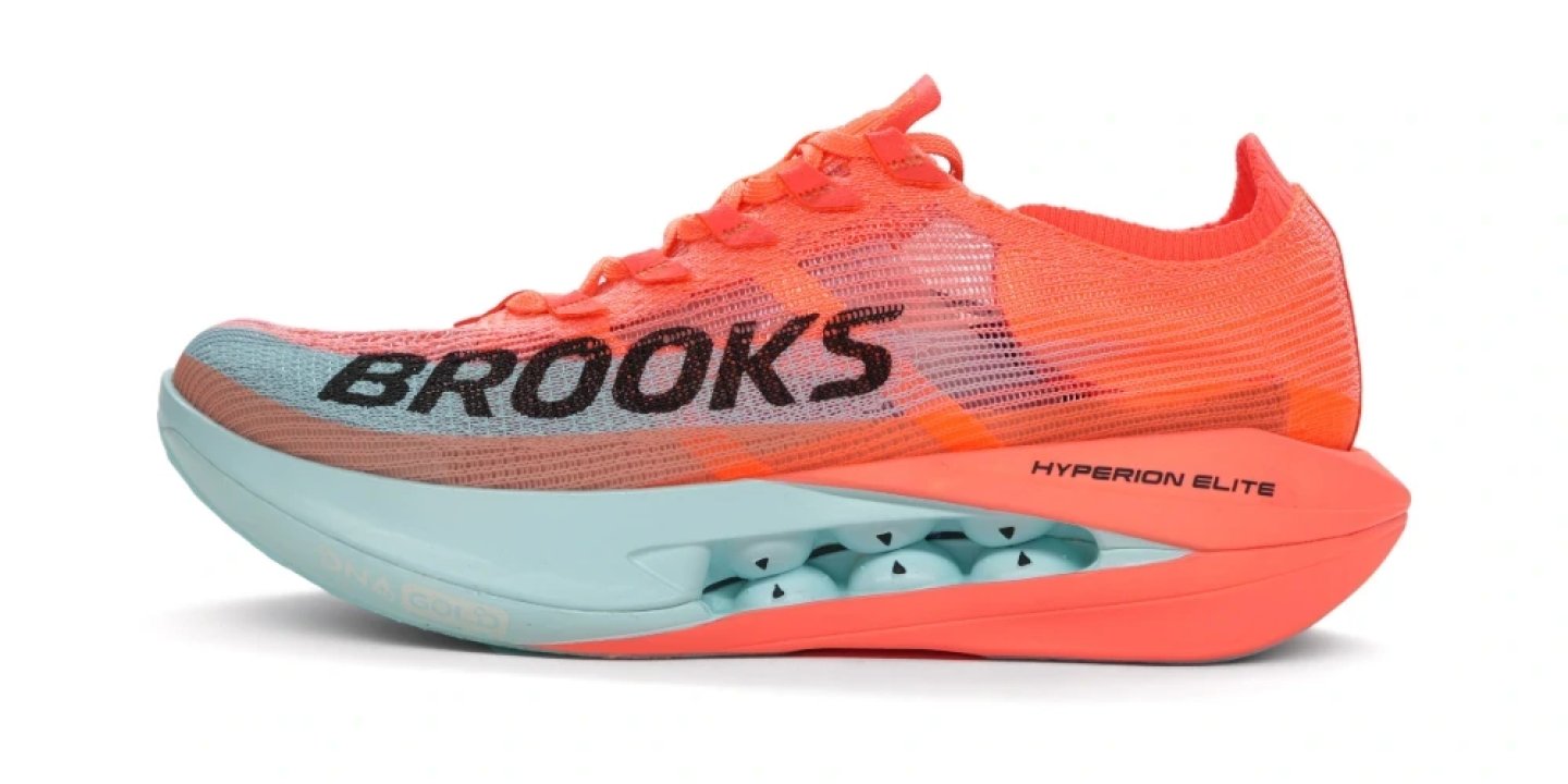 Brooks Hyperion Elite 1 running shoe in coral orange and mint, lateral view showing knit upper and curved midsole