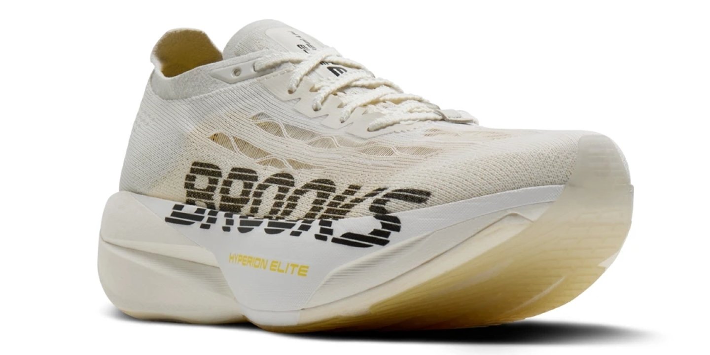 Brooks Hyperion Elite 6 running shoe in cream white with bold Brooks branding and thick rockered midsole
