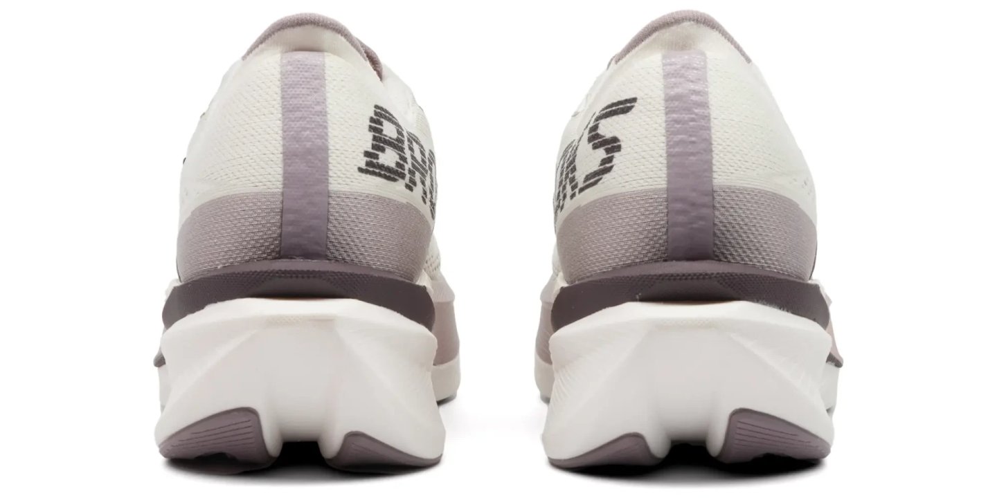 Rear view of a pair of Brooks Hyperion Max 4 running shoes showing the heel, knit upper, and segmented white midsole.