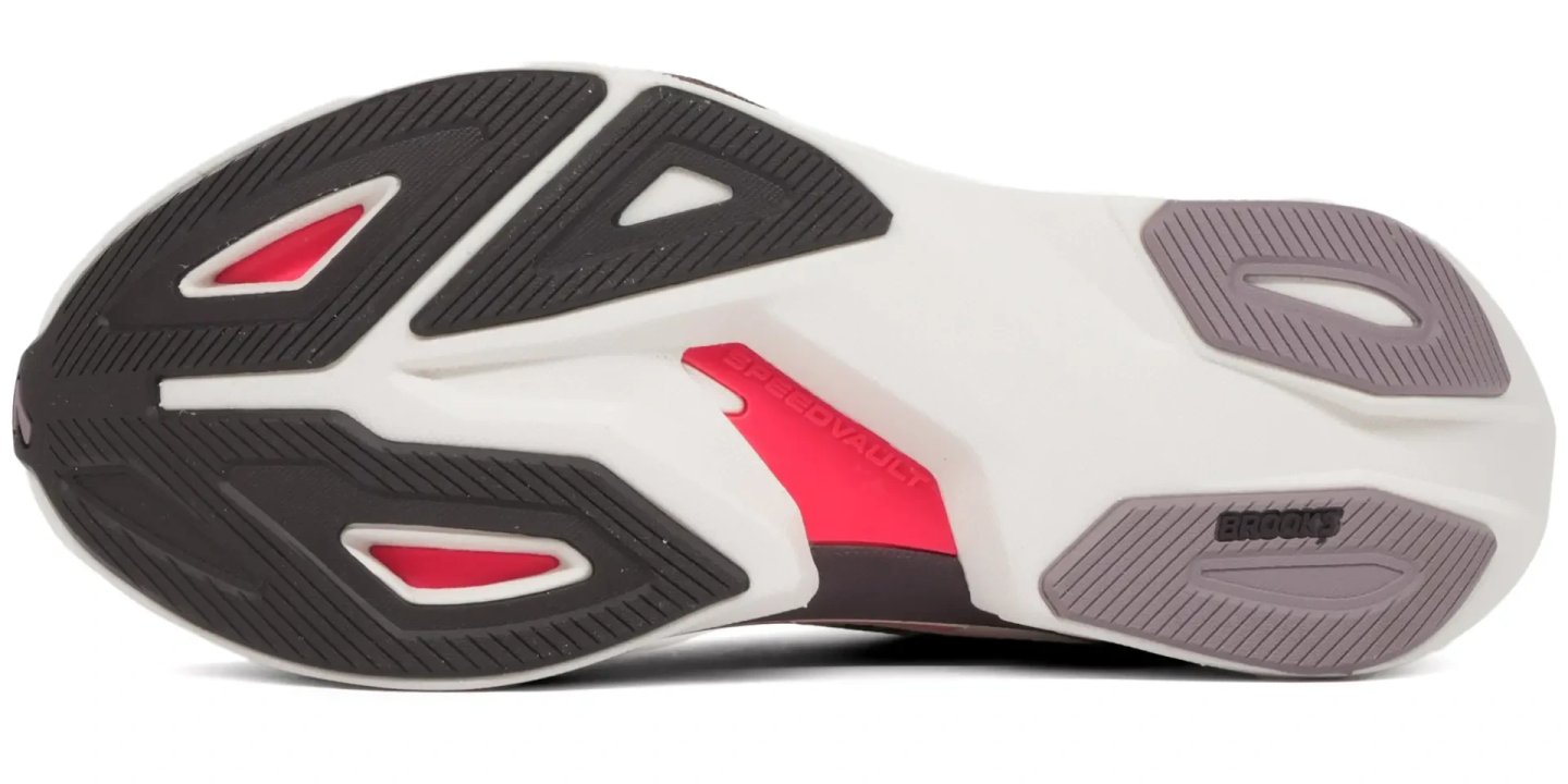 Bottom view of Brooks Hyperion Max 4 running shoe outsole showing SpeedVault midsole, rubber traction zones in black and grey, and red accents
