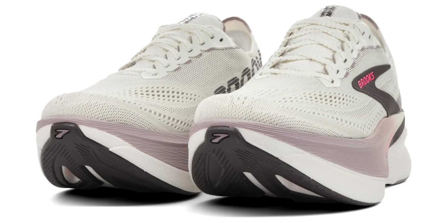 Brooks Hyperion Max 4 running shoes in white and pink, rear three-quarter view showing knit upper and cushioned midsole