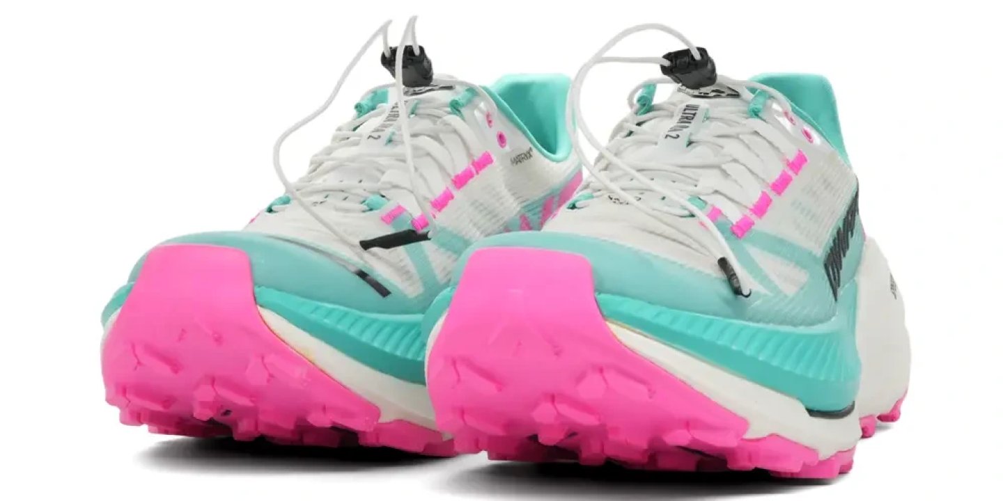 Dynafit Ultra DNA 2 trail running shoes in white, teal and pink, rear three-quarter view showing lugged outsole