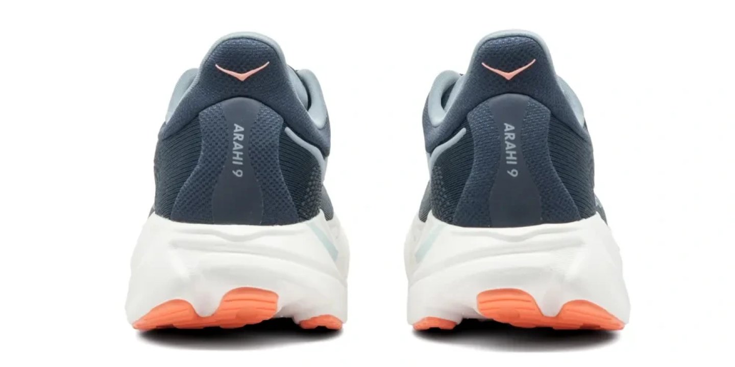Rear view of a pair of Hoka Arahi 9 running shoes in blue with a white midsole and coral rubber outsole