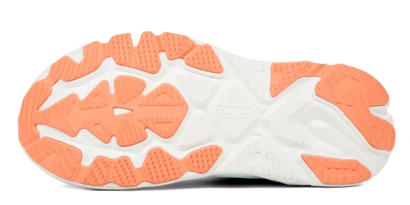 Bottom view of the Hoka Arahi 9 running shoe outsole with coral rubber traction pods on a white midsole base.