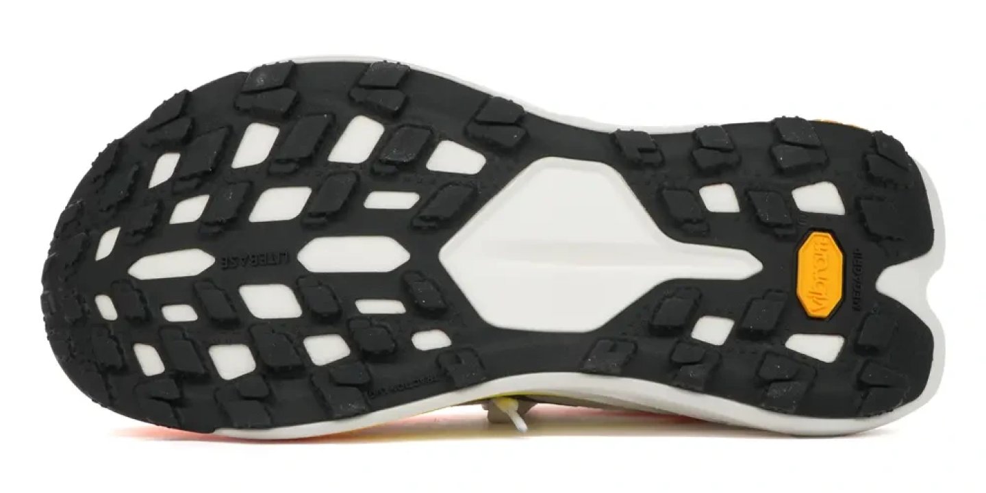 Bottom view of Hoka Tecton X 4 trail running shoe outsole with black Vibram Megagrip lugs and white LiteBase midsole