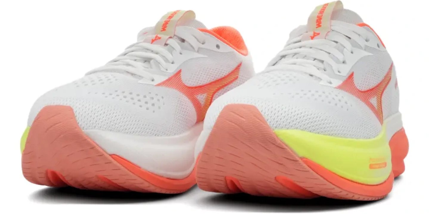 Mizuno Wave Rider 30 running shoes in white with coral orange overlays and neon yellow heel accent, rear three-quarter view