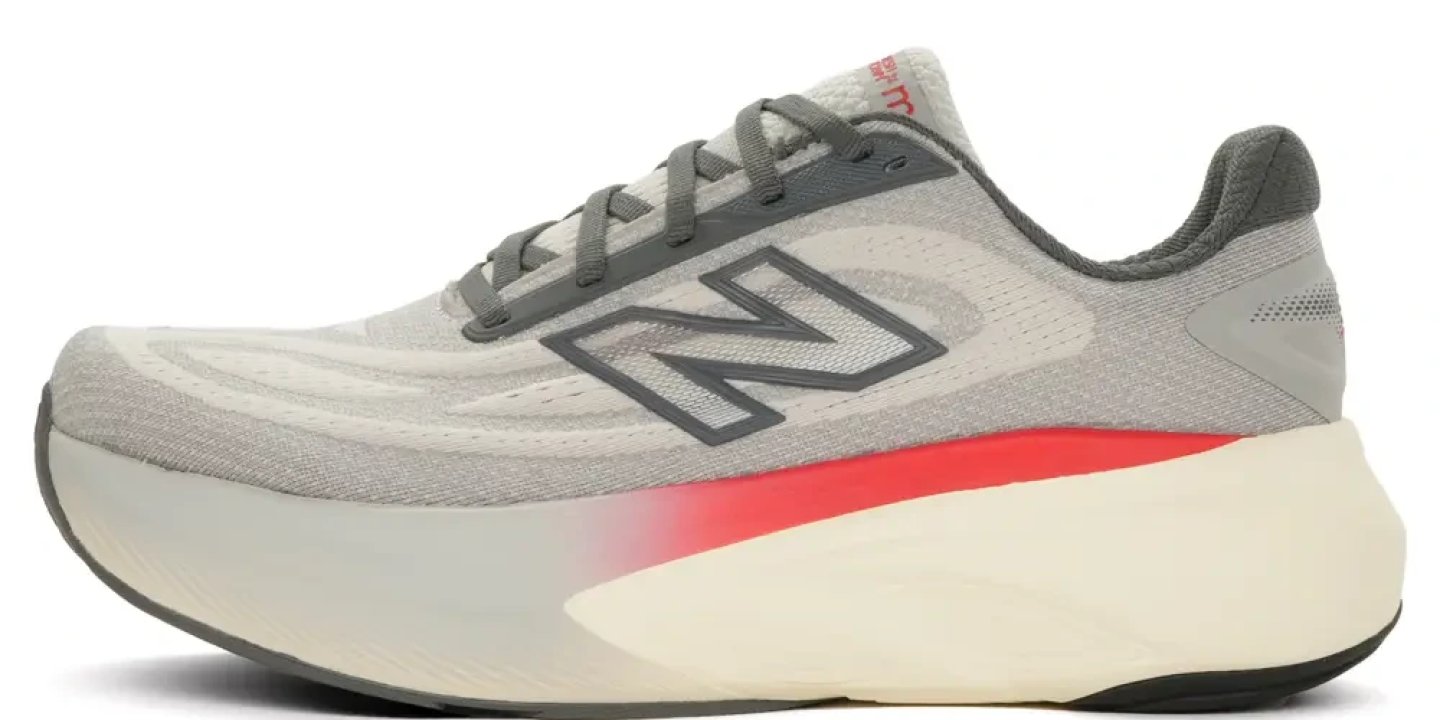 New Balance Fresh Foam More v6 running shoe in grey and red, lateral side view showing chunky midsole and mesh upper