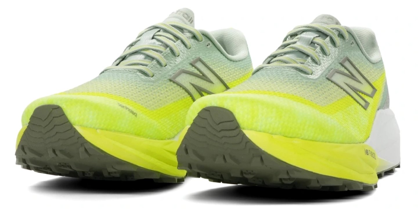 Rear three-quarter studio view of two New Balance SC Trail v2 trail running shoes in mint green and neon yellow