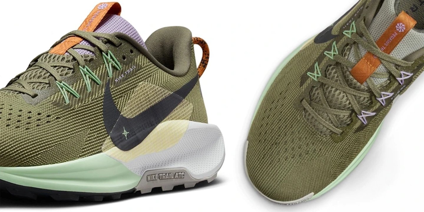 Nike Pegasus Trail 5 trail running shoe fit detail showing olive green mesh upper, mint lace loops and orange pull tab