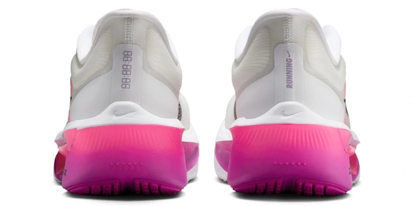 Heel view of Nike Zoom Fly 6 running shoes in white with a vibrant pink and magenta gradient midsole
