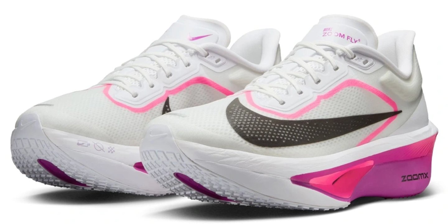 Nike Zoom Fly 6 running shoes in white with pink and purple ZoomX midsole, shown as a pair from a three-quarter angle