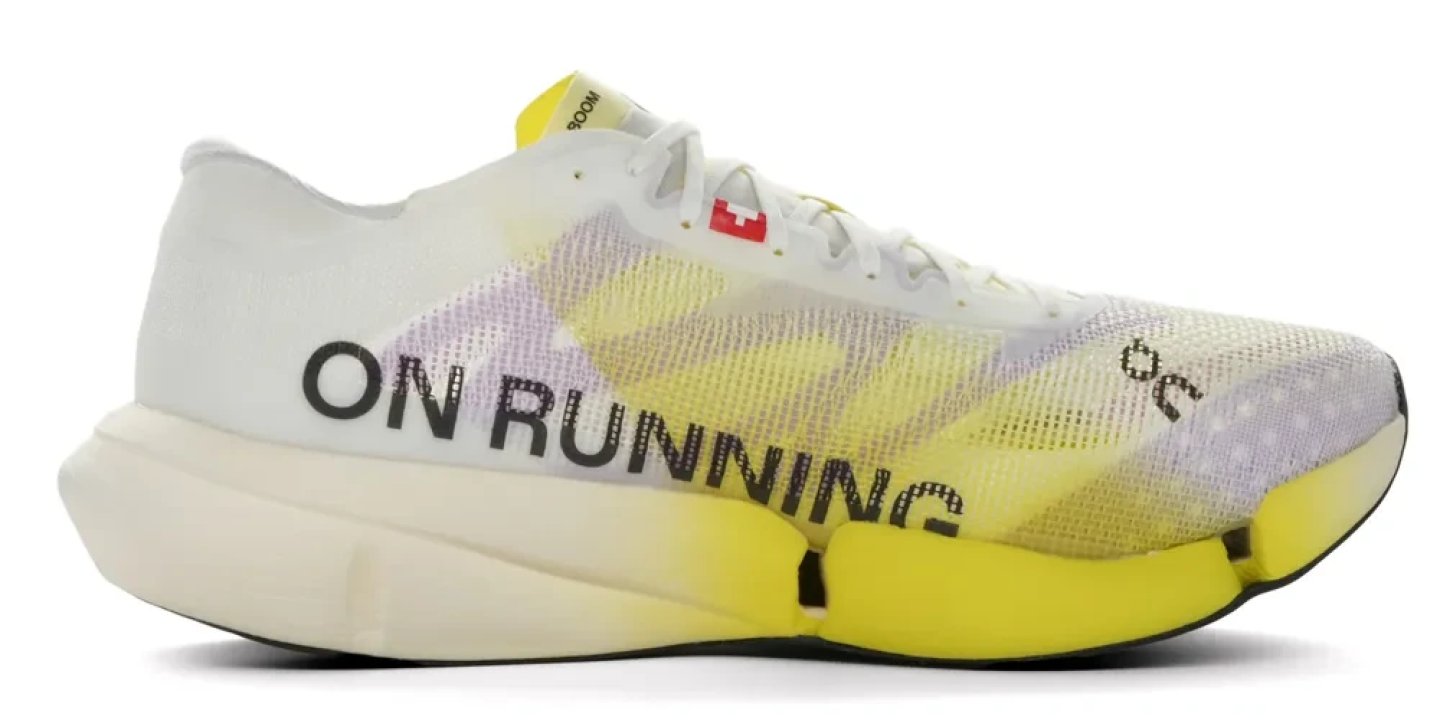 On Cloudboom Strike 2 running shoe in white and yellow with bold On Running branding on the midsole, lateral view
