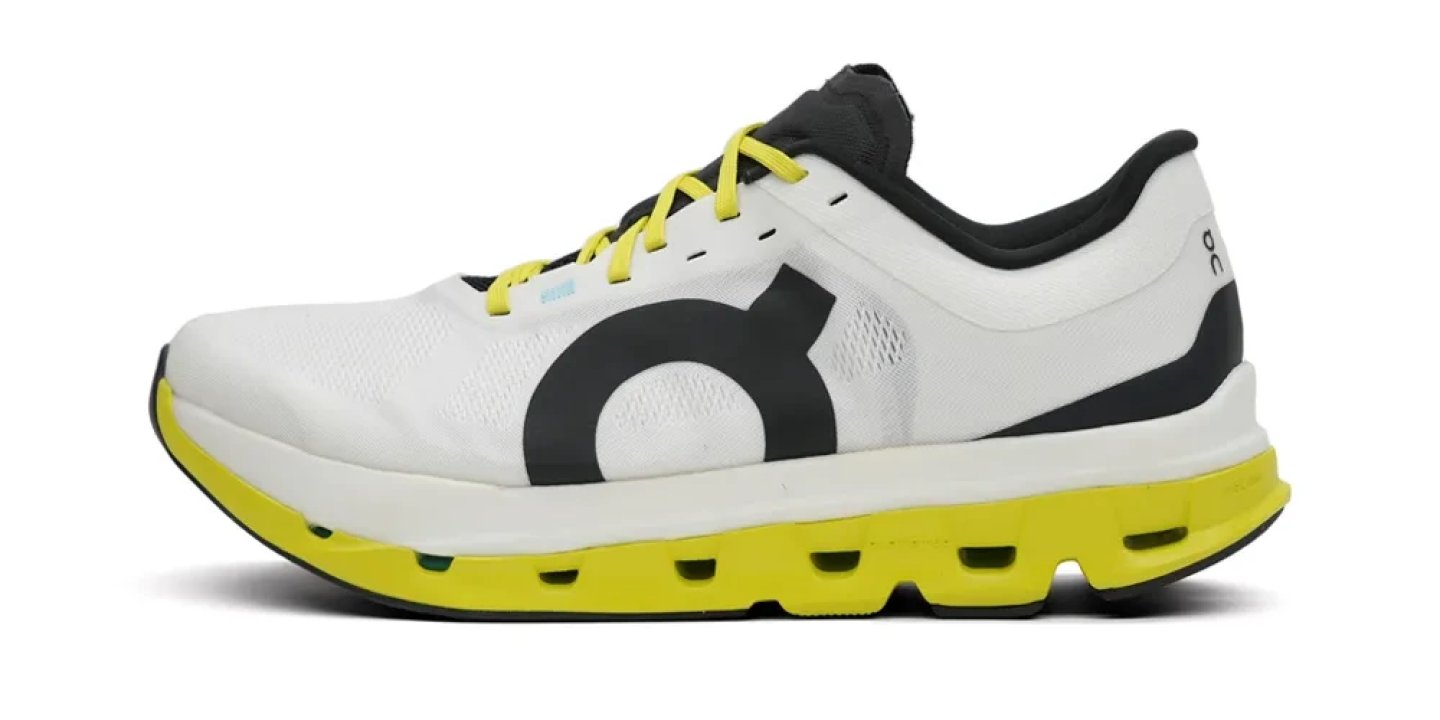 On Cloudflow 5 running shoe in white, black and yellow, lateral view showing CloudTec sole and mesh upper