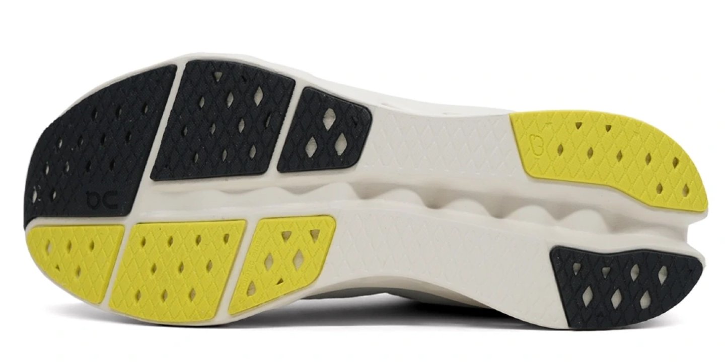 Bottom view of the On Cloudsurfer 2 Zool running shoe outsole showing yellow, black and white CloudTec rubber pods