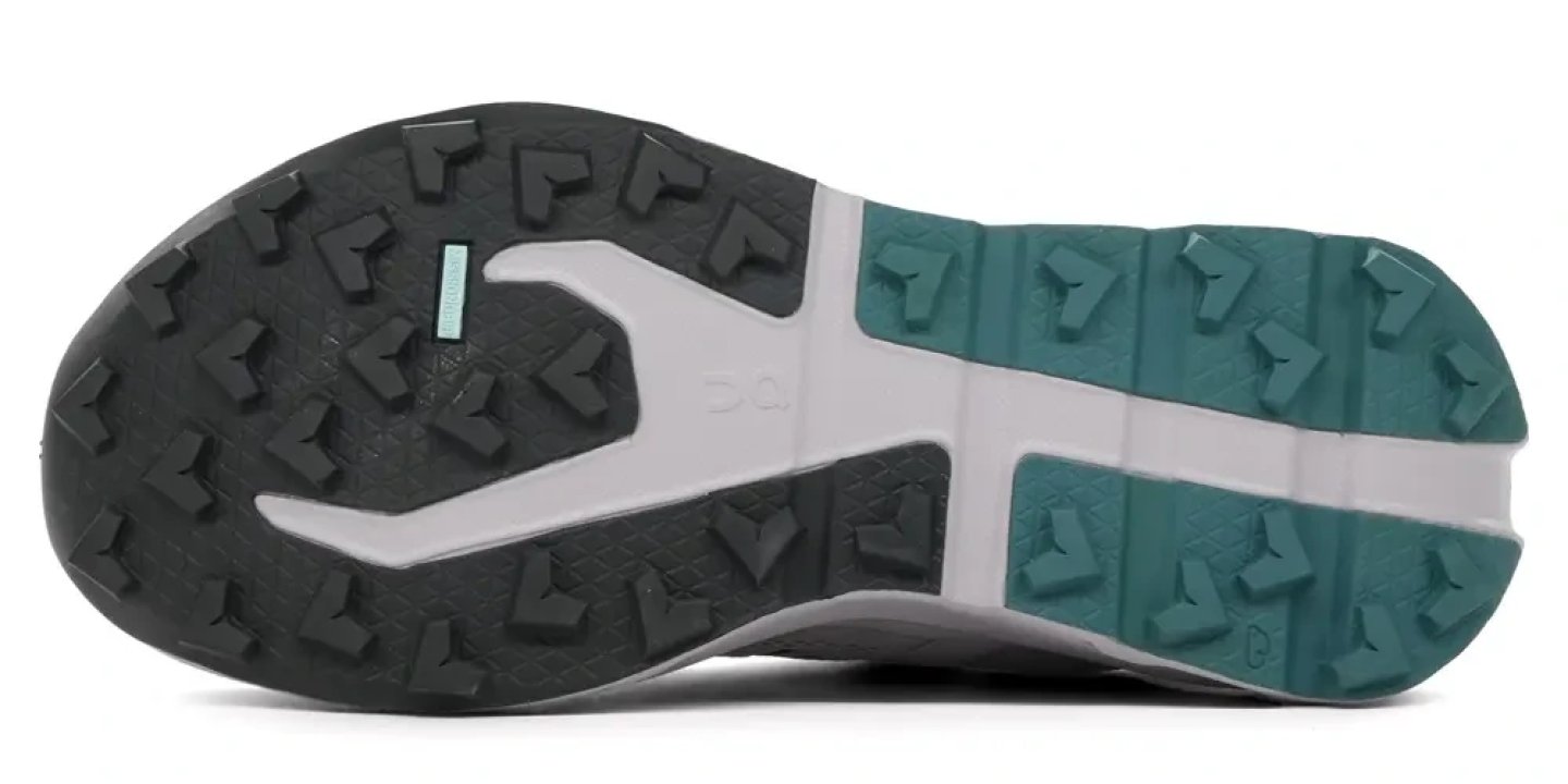 Bottom view of On Cloudvista 3 WP trail running shoe outsole showing dark grey and teal multi-directional lugs with Missiongrip rubber zones.