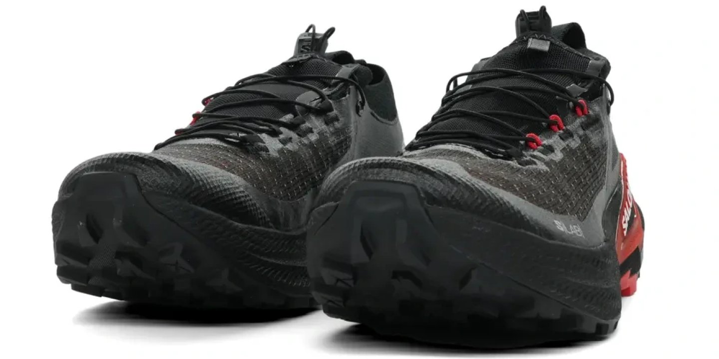 Pair of Salomon S/LAB Genesis 2 trail running shoes in black and red, shown from a front three-quarter angle
