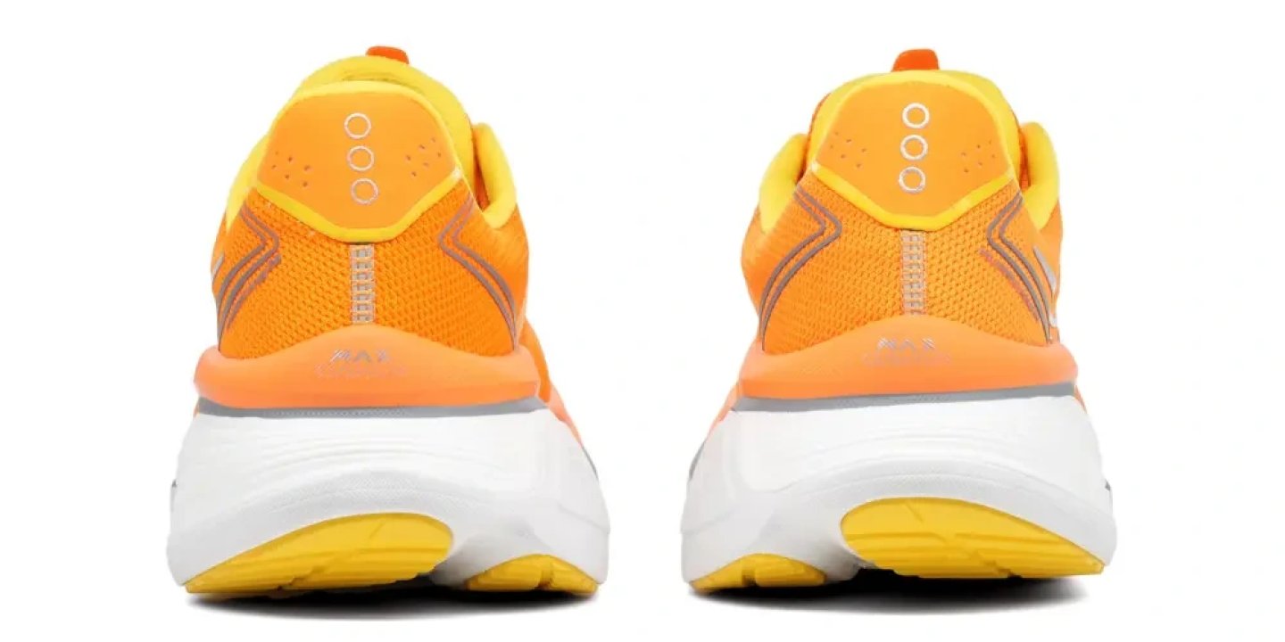 Rear view of a pair of Saucony Hurricane 26 running shoes in orange and yellow with a white and yellow outsole.
