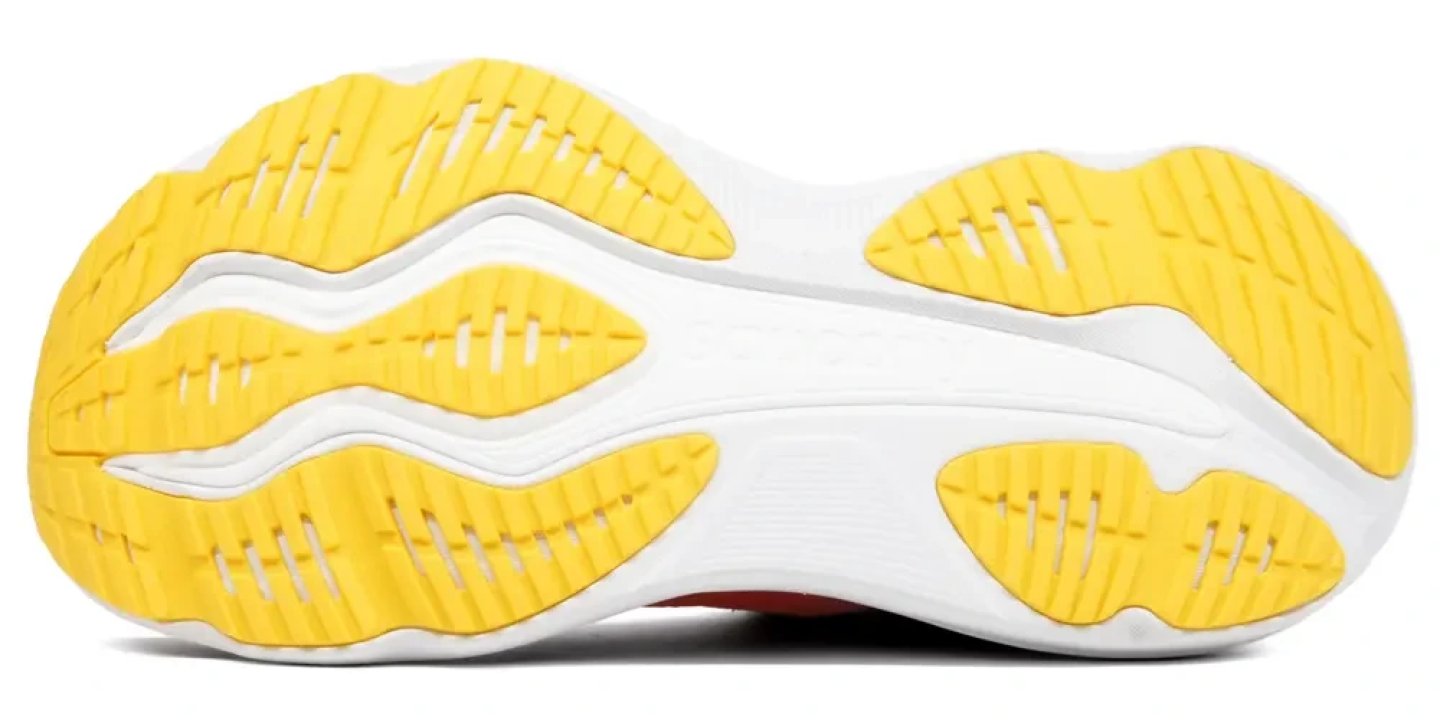 Bottom view of Saucony Hurricane 26 running shoe outsole with yellow rubber traction lugs and white midsole