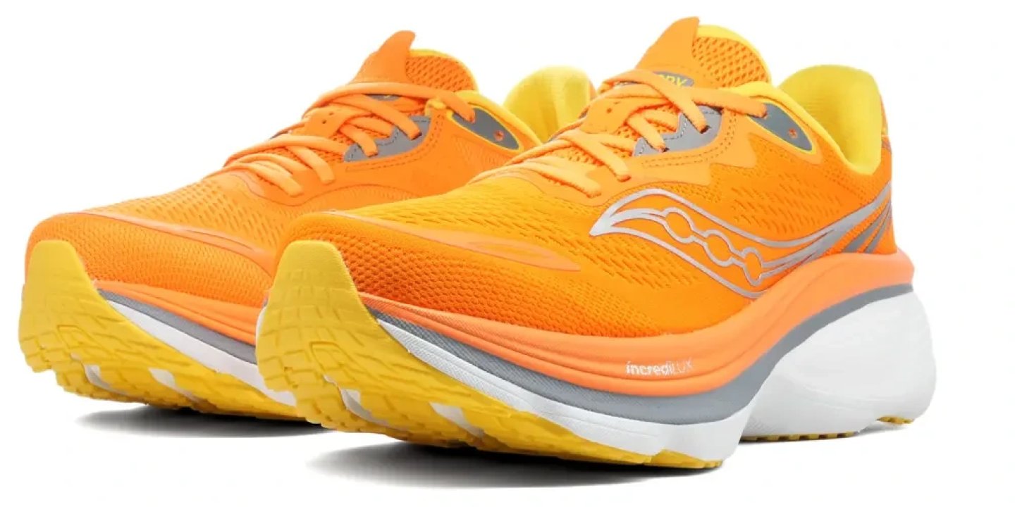 Pair of Saucony Hurricane 26 running shoes in vibrant orange and yellow with silver logo detail and IncrediRun midsole