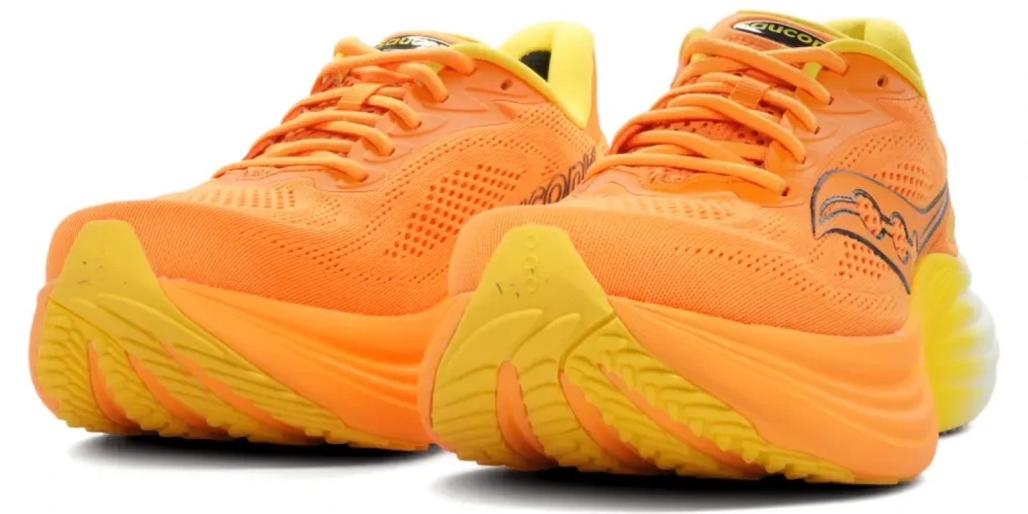 Saucony Triumph 24 running shoes in orange and yellow, front and side view showing mesh upper and cushioned outsole