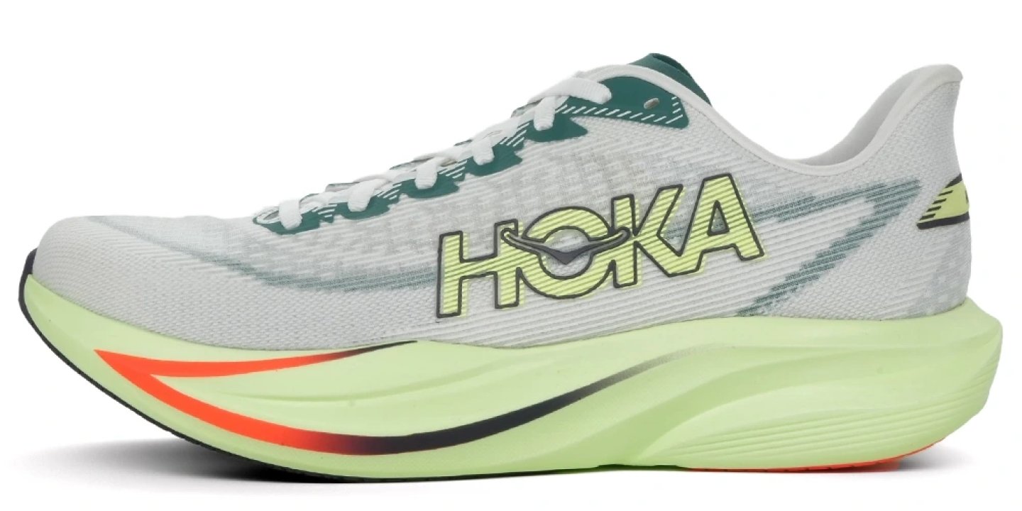 Hoka Mach 7 running shoe in white and mint green with teal accents and orange swoosh detail on midsole