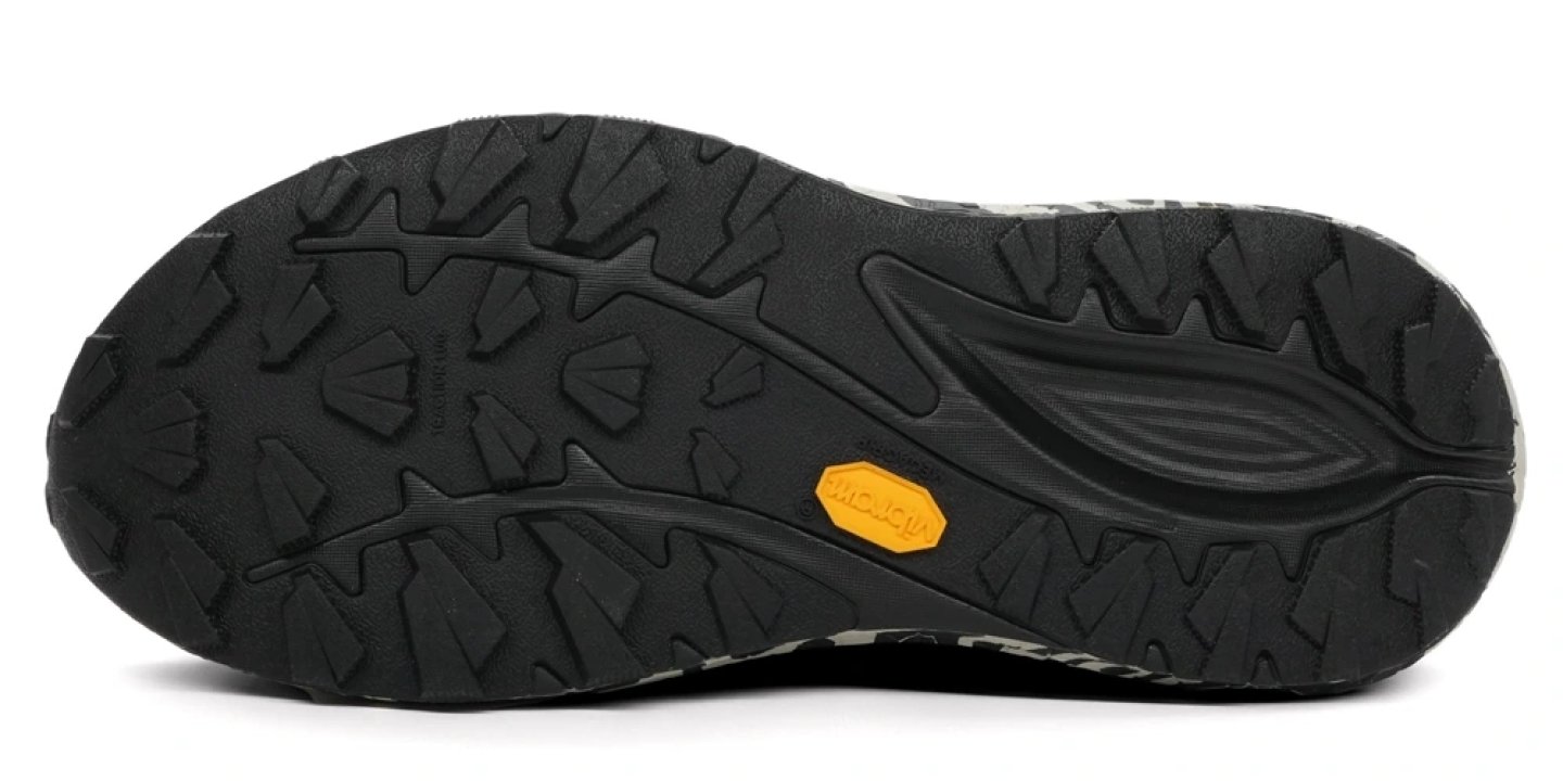 Bottom view of the Mizuno Neo Accera trail running shoe outsole with black Vibram rubber lugs and central flex groove.