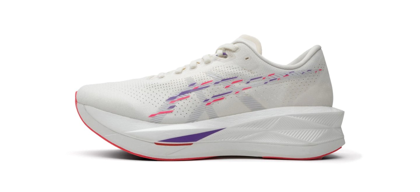 Lateral view of Asics running shoe in white with purple and pink zigzag graphics, thick cushioned midsole and red outsole