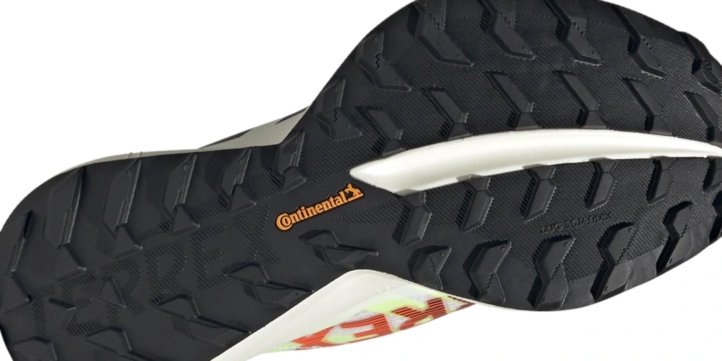 Bottom view of the Adidas Terrex Agravic Speed Ultra 2 showing black Continental rubber outsole with aggressive lug pattern