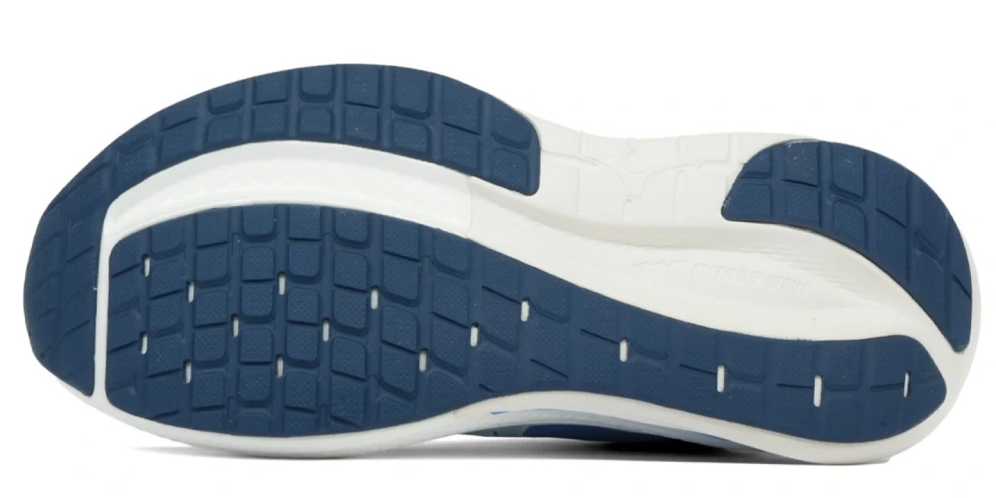 Bottom view of the Mizuno Wave Inspire 22 running shoe outsole in blue and white, showing rubber traction pattern and midsole.