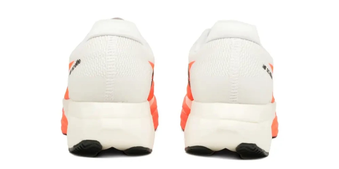 Rear view of New Balance FuelCell SuperComp Elite v5 in white and orange, showing heel counter and midsole stack