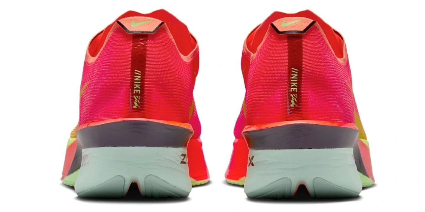 Rear heel view of the Nike Vaporfly 4 in vivid pink, red, orange and volt with a pale green ZoomX midsole