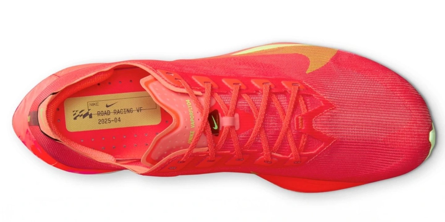 Top view of the Nike Vaporfly 4 road racing shoe in red with volt Swoosh accents and red laces