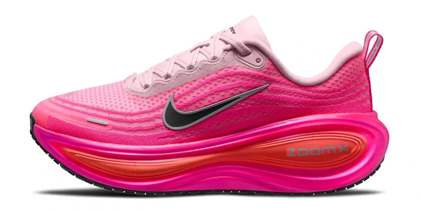 Nike Vomero Plus women's running shoe in pink with ZoomX midsole, black Swoosh, and pink laces, lateral view