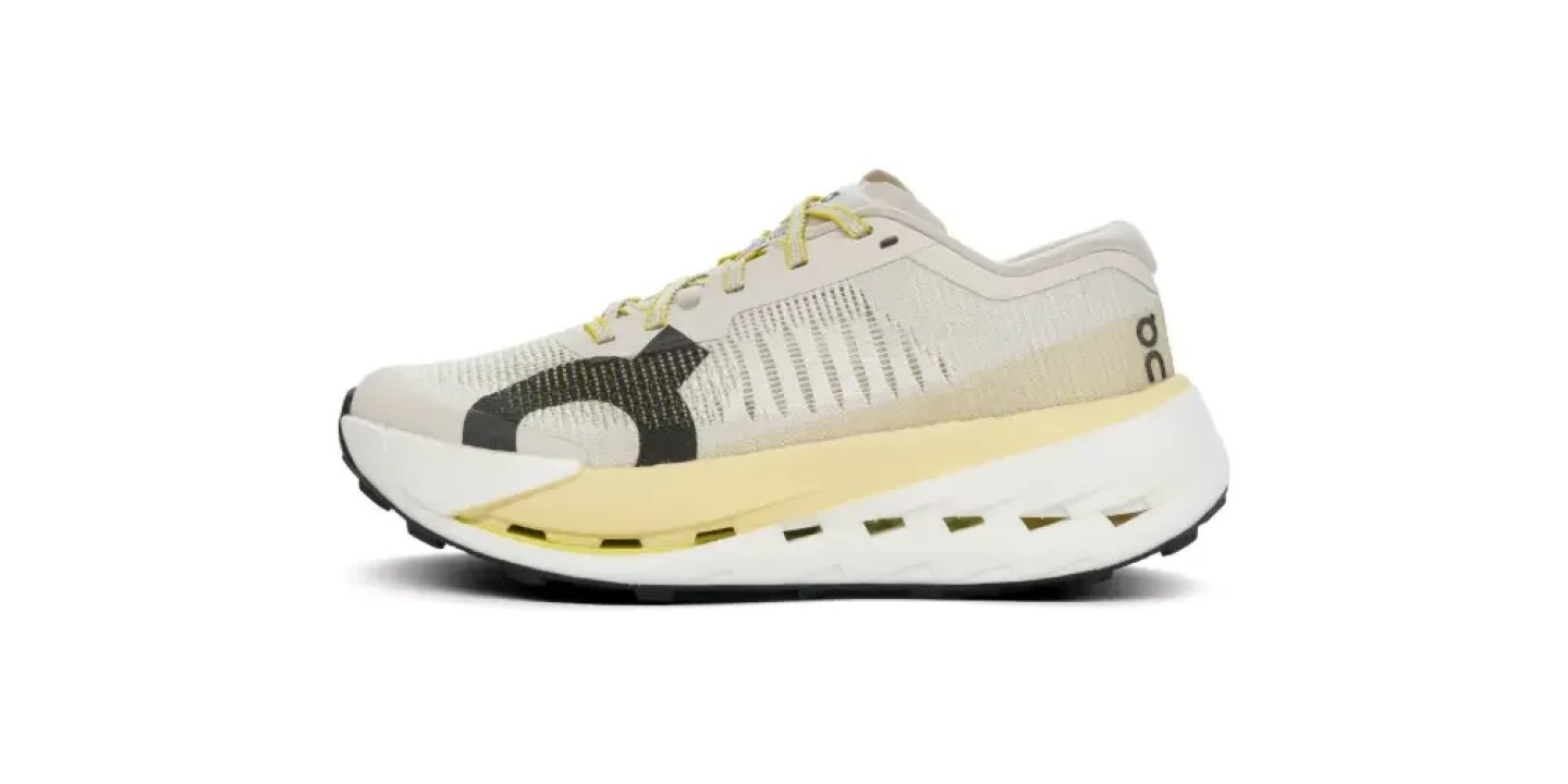 On Running Cloudmonster trainer in cream knit upper with yellow laces and oversized white CloudTec cushioned midsole.