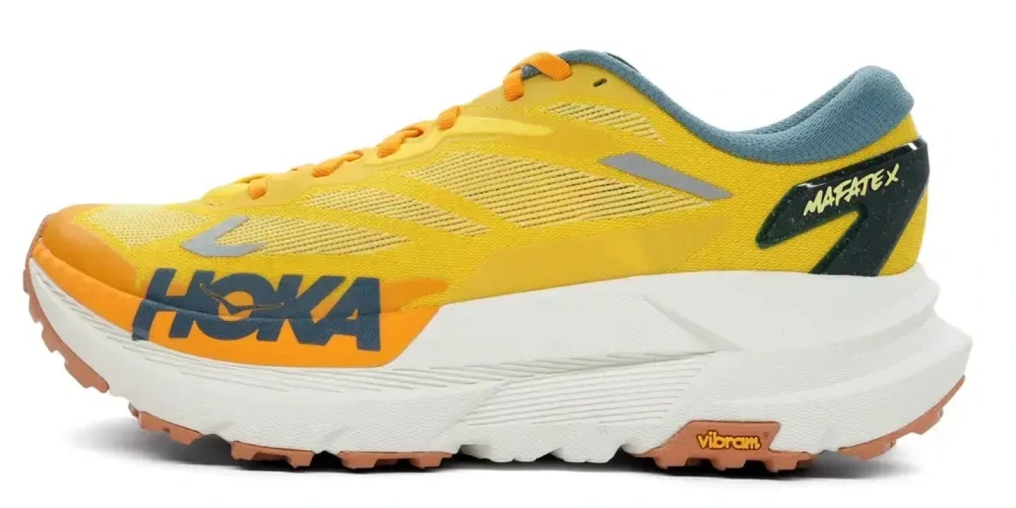 Hoka Mafate X trail running shoe in yellow and orange with white midsole and Vibram outsole, lateral view