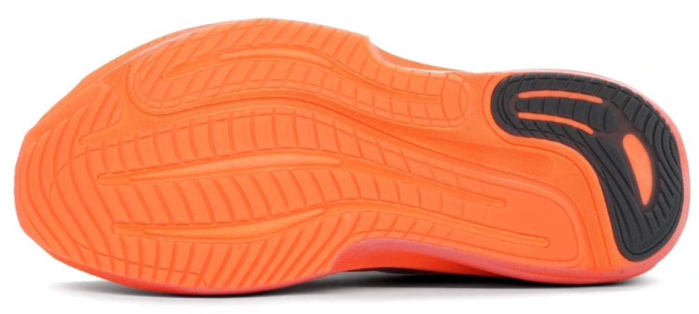 Bottom view of Adidas Supernova Rise 3 running shoe outsole in orange with flex grooves and black rubber heel pod